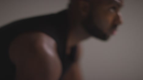 Close-Up-Studio-Shot-Of-Male-Basketball-Player-Dribbling-And-Bouncing-Ball-Against-White-Background-1