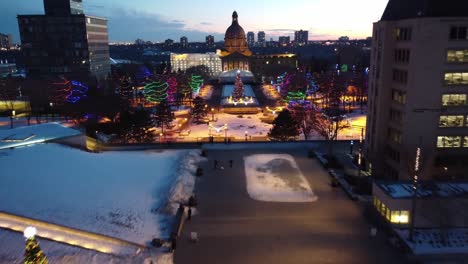 4k twilight aerial fly over led runway quiet winter post modern provincial legislature buildings centered with a beaux arts dome top government structure of capital city edmonton alberta canada 4-4