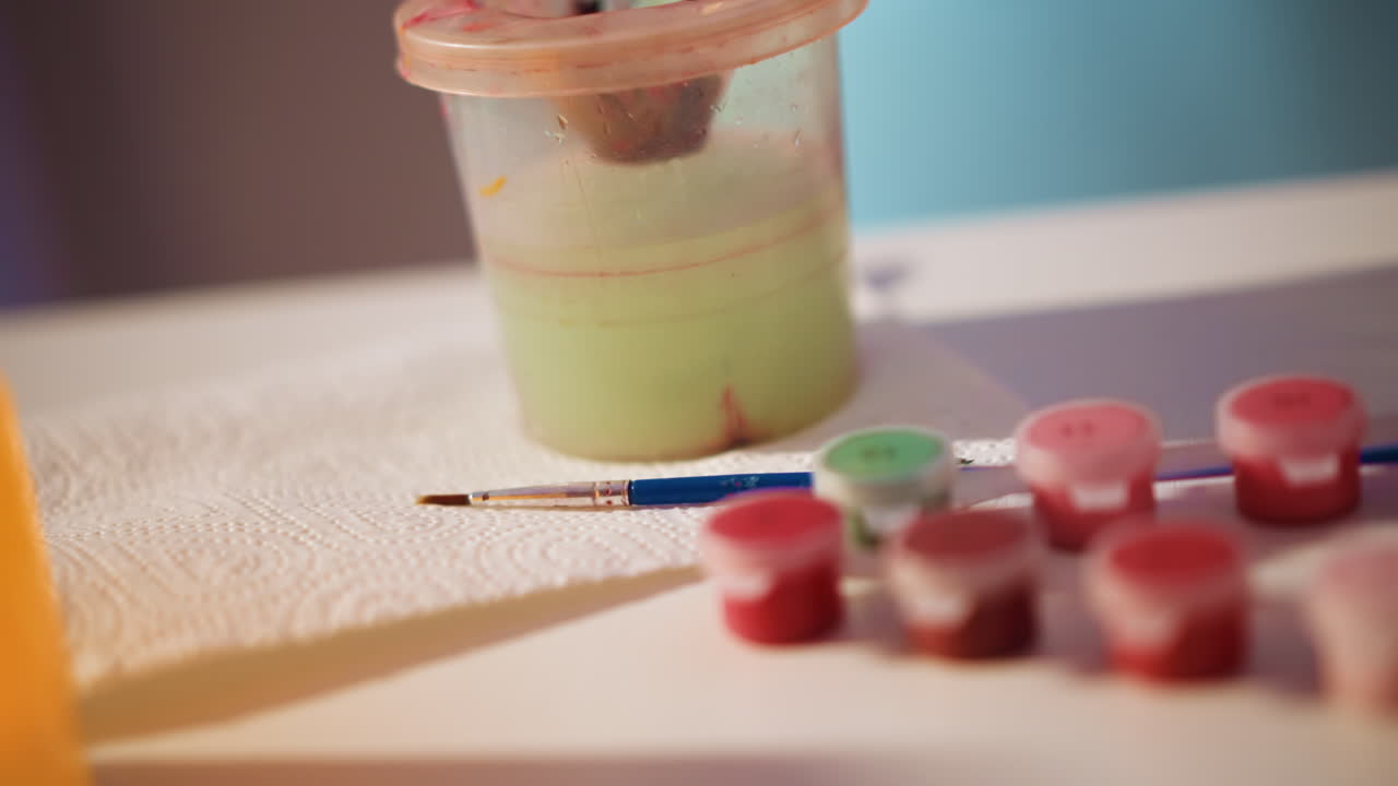 Painting Area Fully Arranged And Lit, Workspace Organized With Textured Tools And Illumination, All Materials And Lighting In Place For Artistic Creation Using Textured Painting Instruments