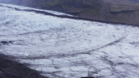 impressive large ice surface of shrinking glacier in iceland, overcast weather