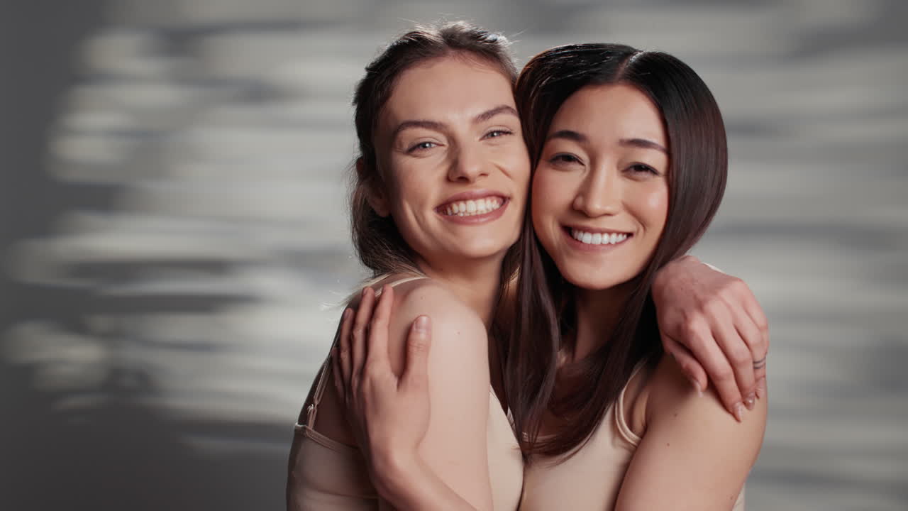 Two Women Embracing and Smiling