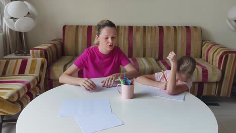 mother and daughter doing homework together
