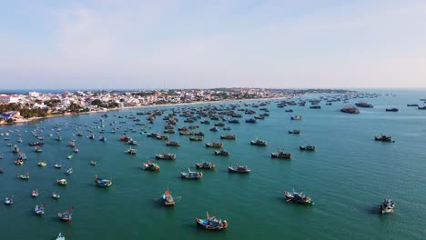 hundreds of fishing boats anchored in mui ne bay, vietnam