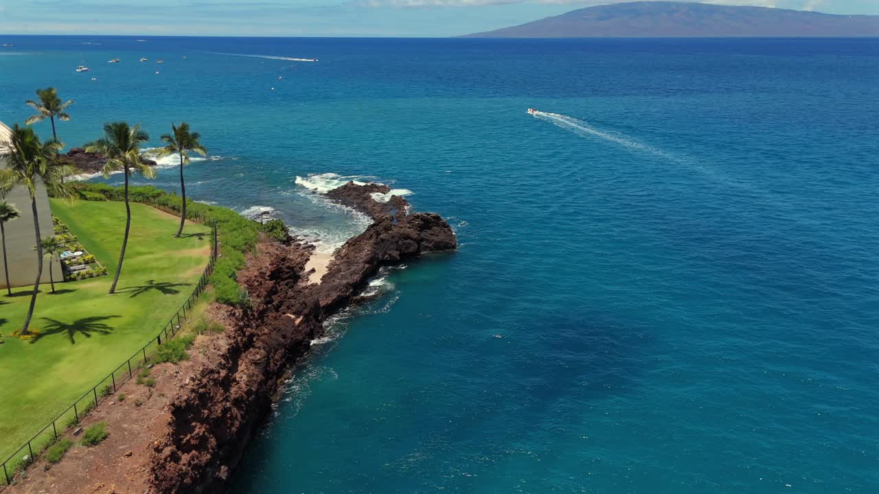 Aerial view of the point of black rock off of the Sheraton hotel in Maui, Hawaii