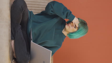 vertical video of young woman with headache.