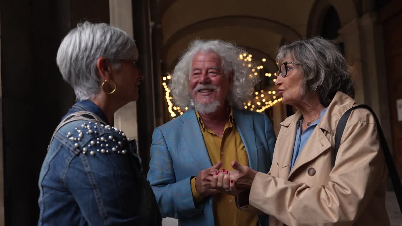 Three Senior Friends Chatting Outdoors