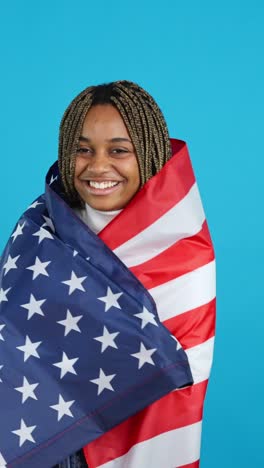 happy woman celebrating with american flag