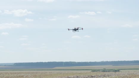 professional drone with camera flying in the blue sky