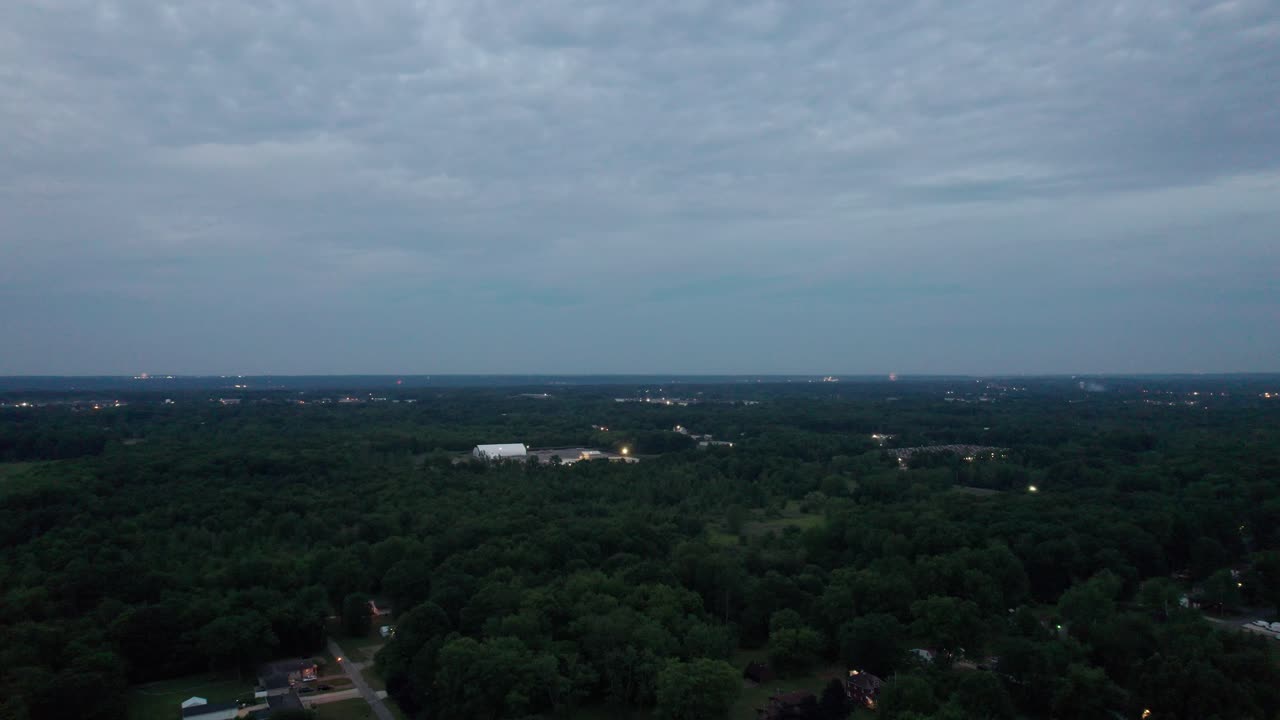 Drone shot footage of an Ohio forest at night in a cloudy sky