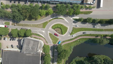 top down aerial of cars driving over busy intersection