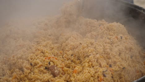 large pot of steaming pilaf