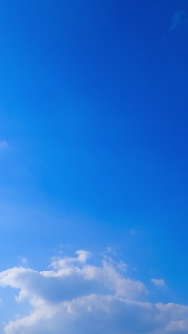 Summer blue sky flowing. Beautiful weather time lapse scenery. Vertical video