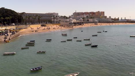 slow pan across small fishing boats parked in harbor of cadiz