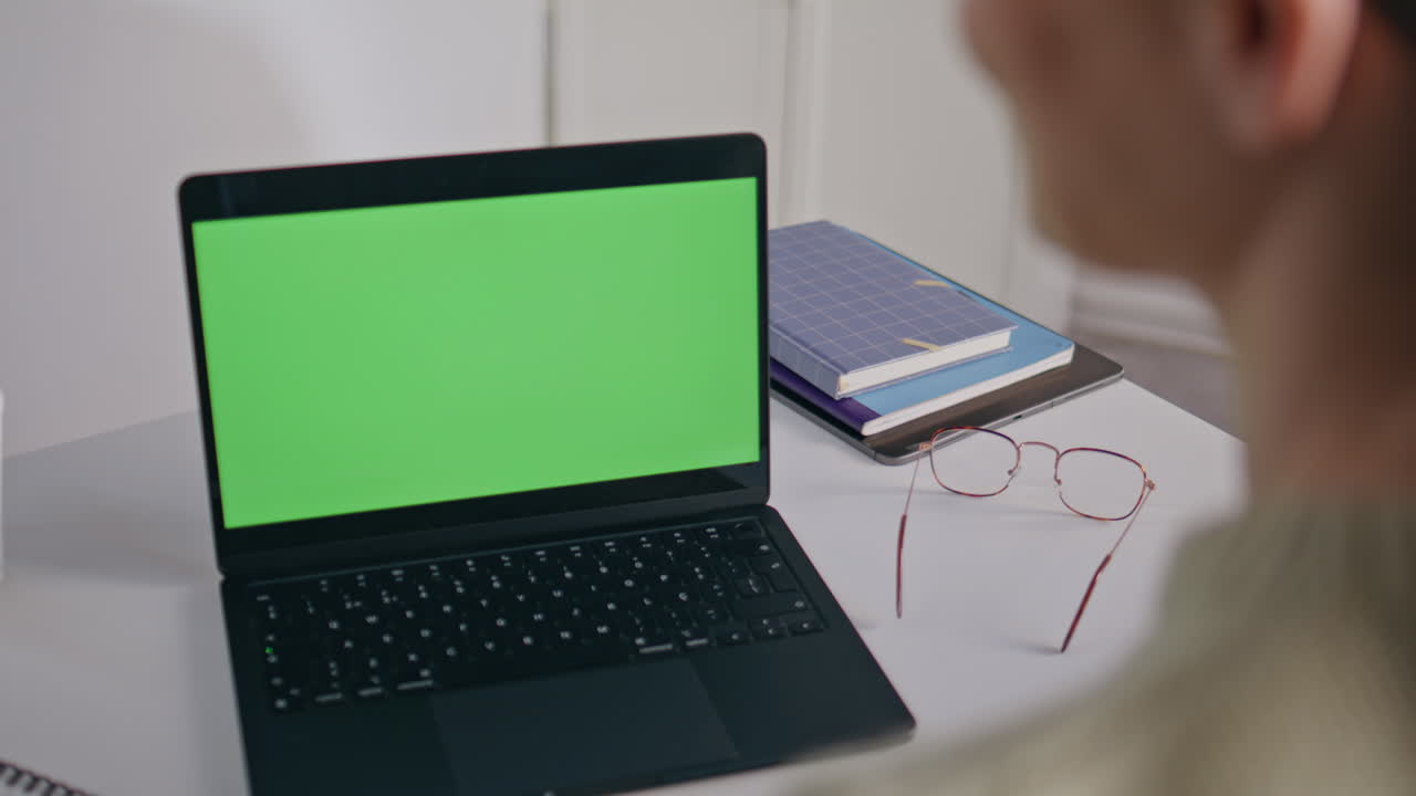 Teacher checking homework chromakey laptop closeup. Woman looking green screen