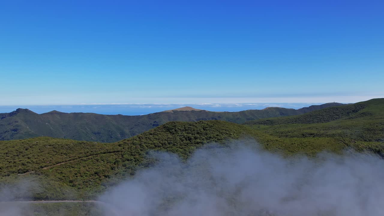 Scenic aerial view of lush mountains in Madeira, Portugal on a clear day