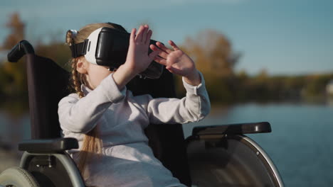 Girl-with-disability-looks-at-hands-through-VR-glasses