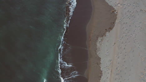 aerial view of a beach and ocean waves