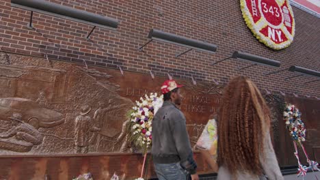 nine eleven fire department memorial wall with wreaths in new york city, close-up shot in daylight