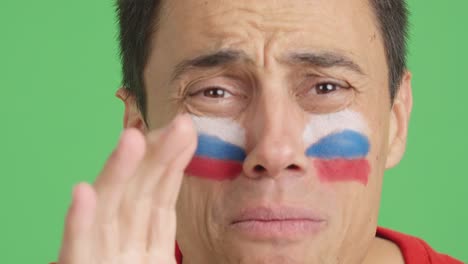 Very nervous man supporting russian team during a difficult match