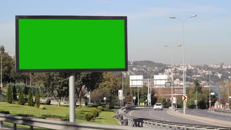 advertising billboard green screen on sidelines of expressway with traffic 1