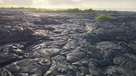 Low-drone-push-in-captures-dried-lava-fields-on-Big-Island,-Hawaii