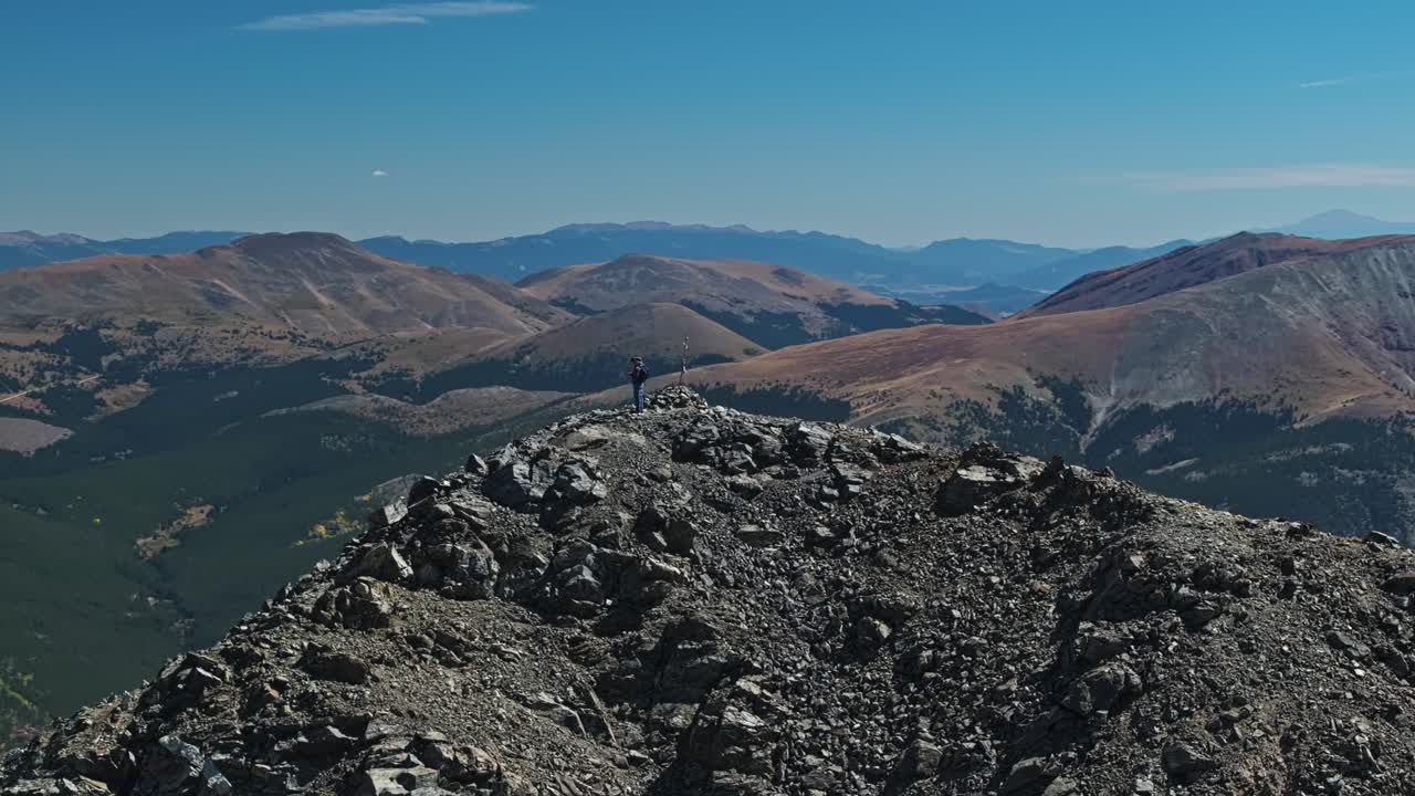 Hikers on a Mountain Summit with Stunning Views