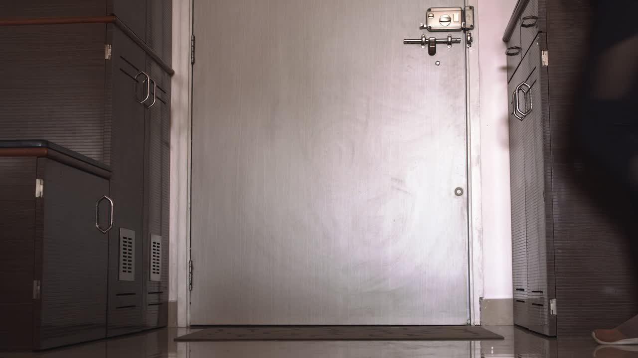 Beagle being taken for a walk, through wooden door and metal gate