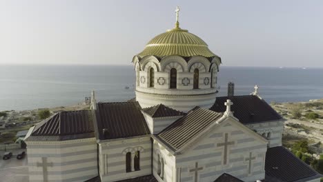 aerial view of a beautiful orthodox church by the sea