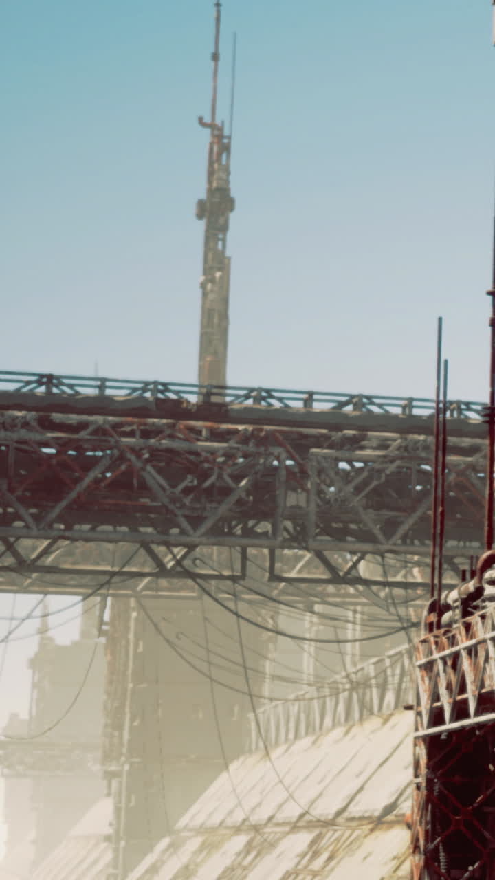 Construction site showcases metal framework and support structures in sunlight