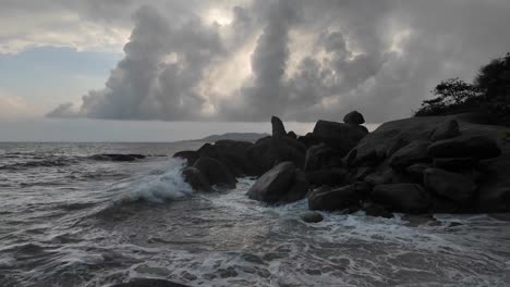 sea waves collide with the rocky and rugged shores of koh samui, thailand, with untouched natural beauty and the spirit of freedom, travel, and leisure