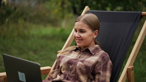 woman working outdoors on laptop