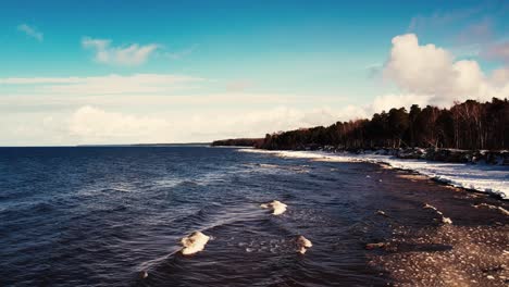 Drone-flight-over-the-sea-in-winter-Frozen-rocks-on-the-coast