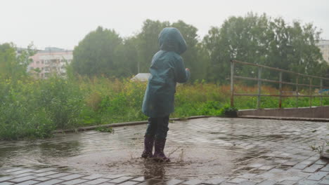 kid finds delight in jumping in puddle child carefree antics demonstrate essence of happy childhood