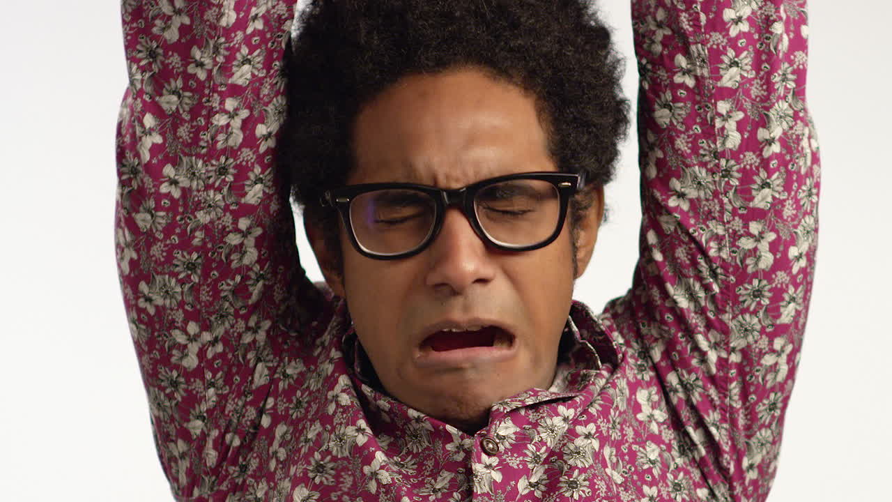 Close Up of Man Yawning and Stretching