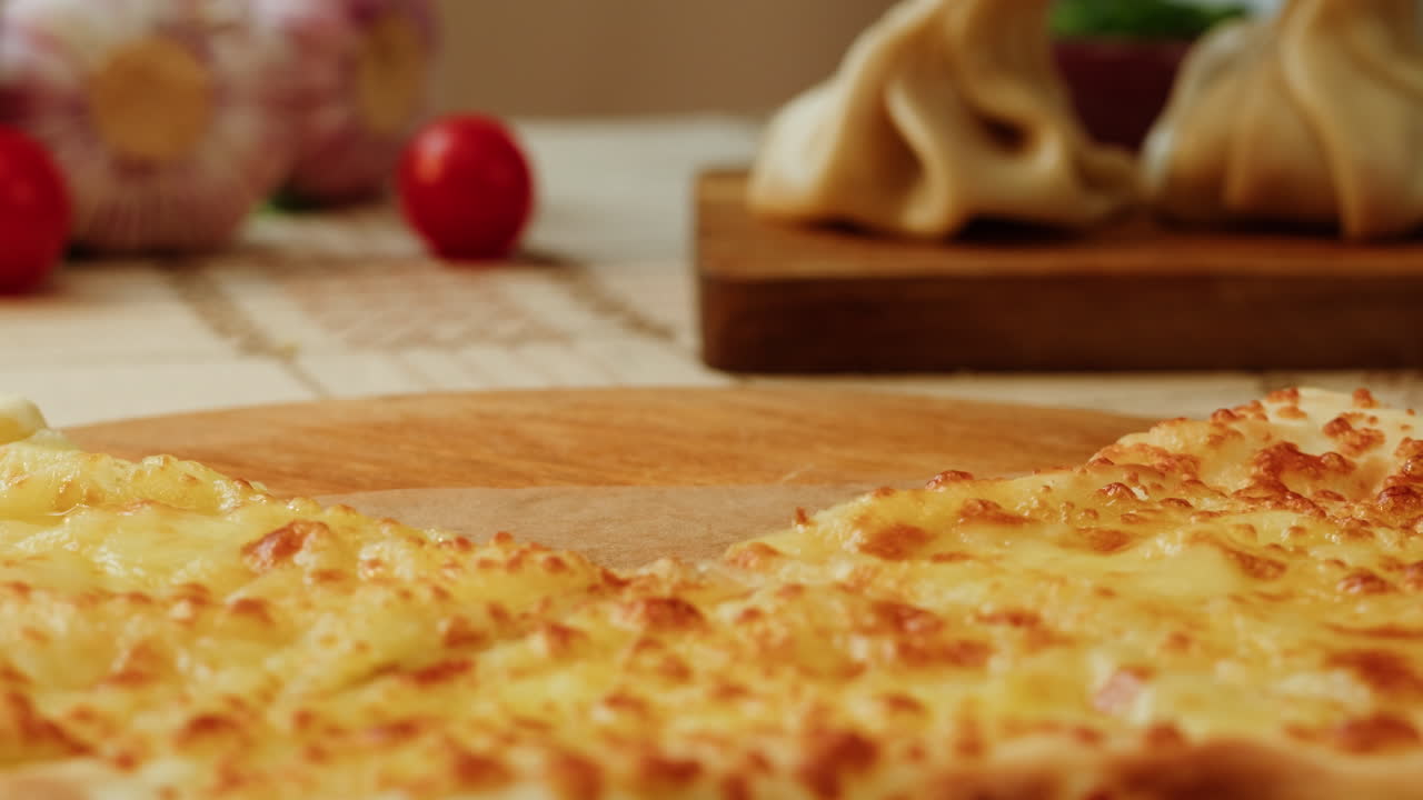 Woman eating a piece of Khachapuri