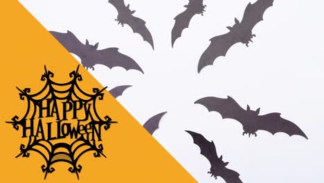 animation of happy halloween text over bats