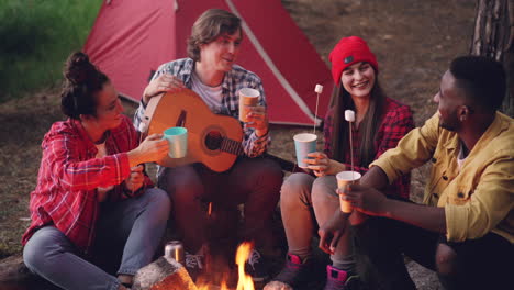 friends camping and making memories by the campfire