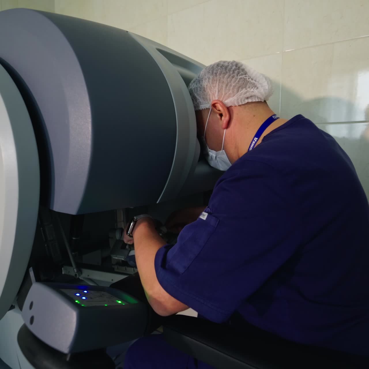 Surgeon operating medical robotic surgery machine. Manual control by Minimally Invasive Surgical System. Da Vinci Surgery