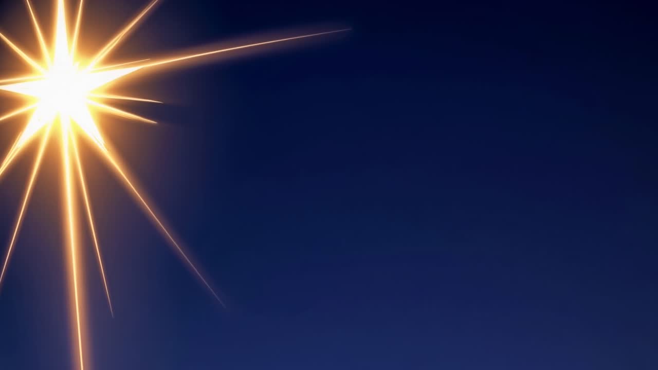 A dynamic starburst effect against a deep blue background, captured from a low angle