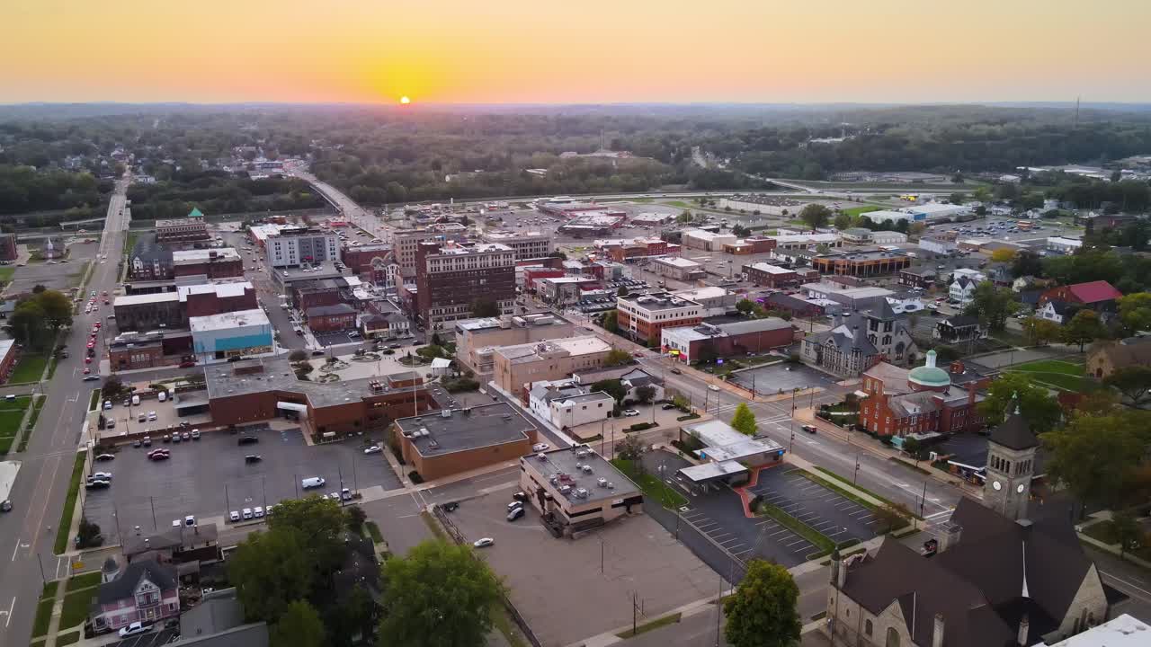 Aerial view of downtown Massillon, Ohio at sunset featuring historic buildings and streets. Crane Down Sunset W