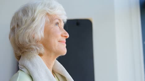 thoughtful senior women in yoga center 4k