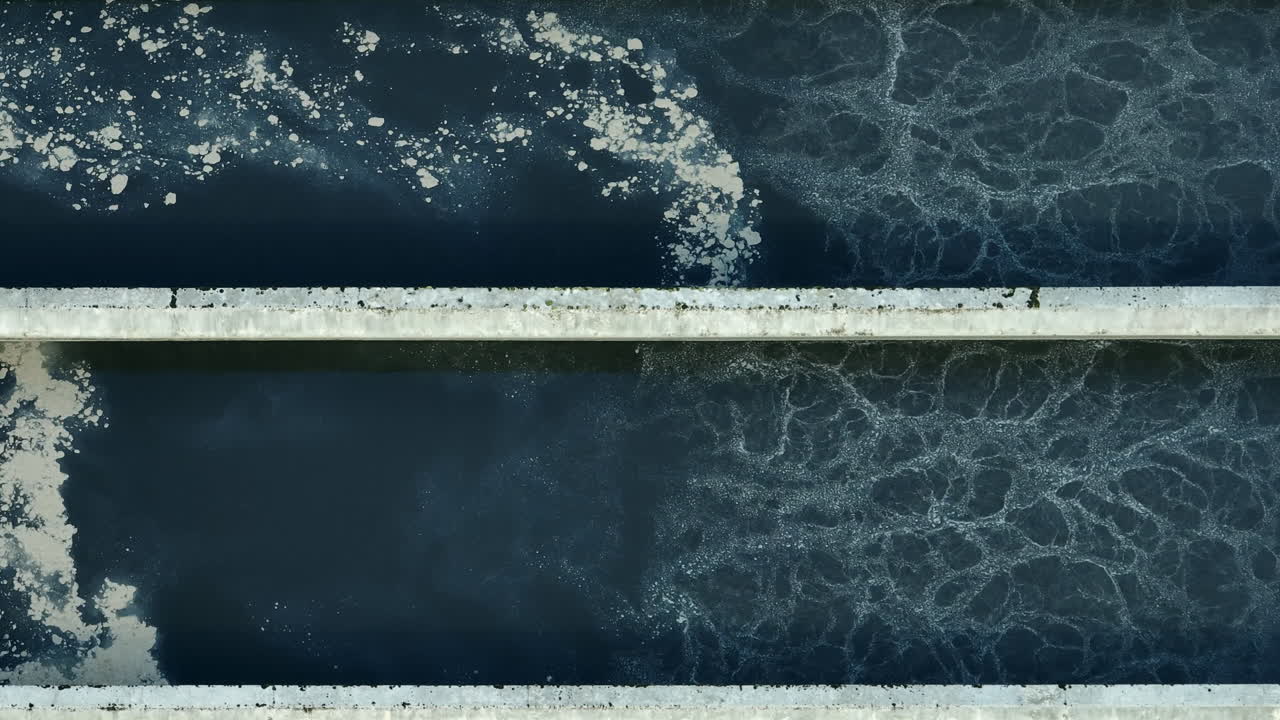 Aerial views of a wastewater treatment plant show effective water purification and sustainable