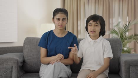 Angry-Indian-siblings-fighting-to-the-camera