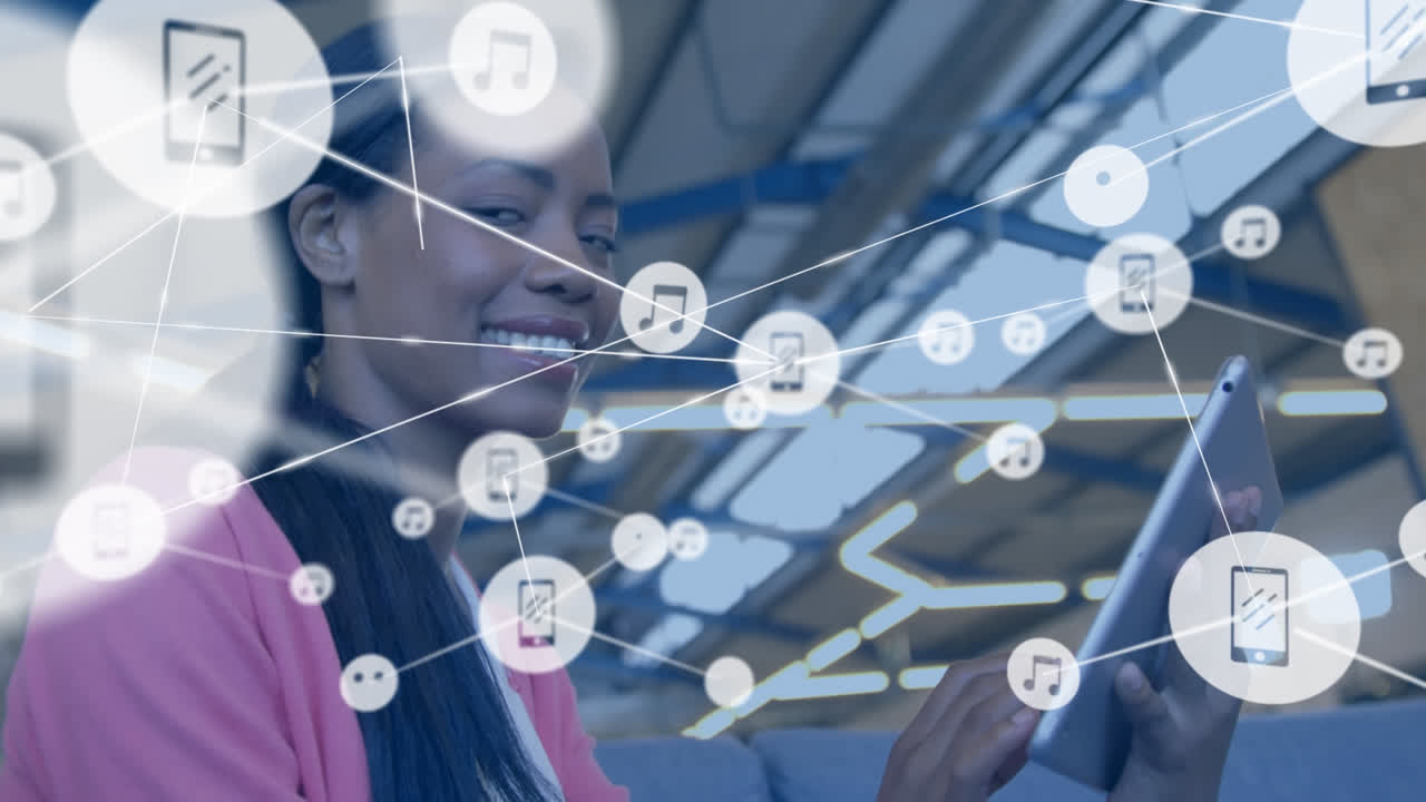 Animation of network of profile icons against biracial woman using digital tablet at office