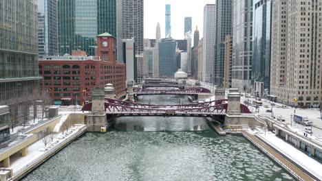 cinematic establishing shot - flying above bridges in downtown chicago, winter