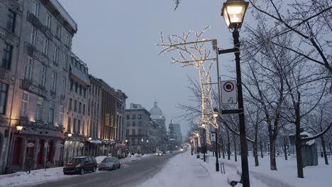 empy road in old montreal during snowy winter