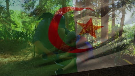 algerian flag overlaying group sitting in forested area, enjoying nature together