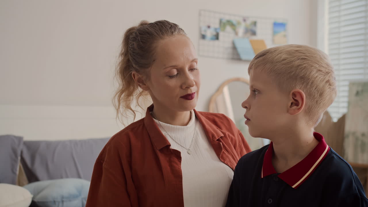 Caring Mother Cuddling Her Son Having Problems at School