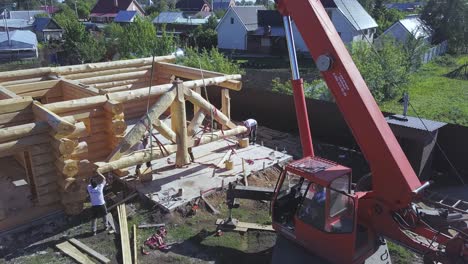 log cabin construction with crane