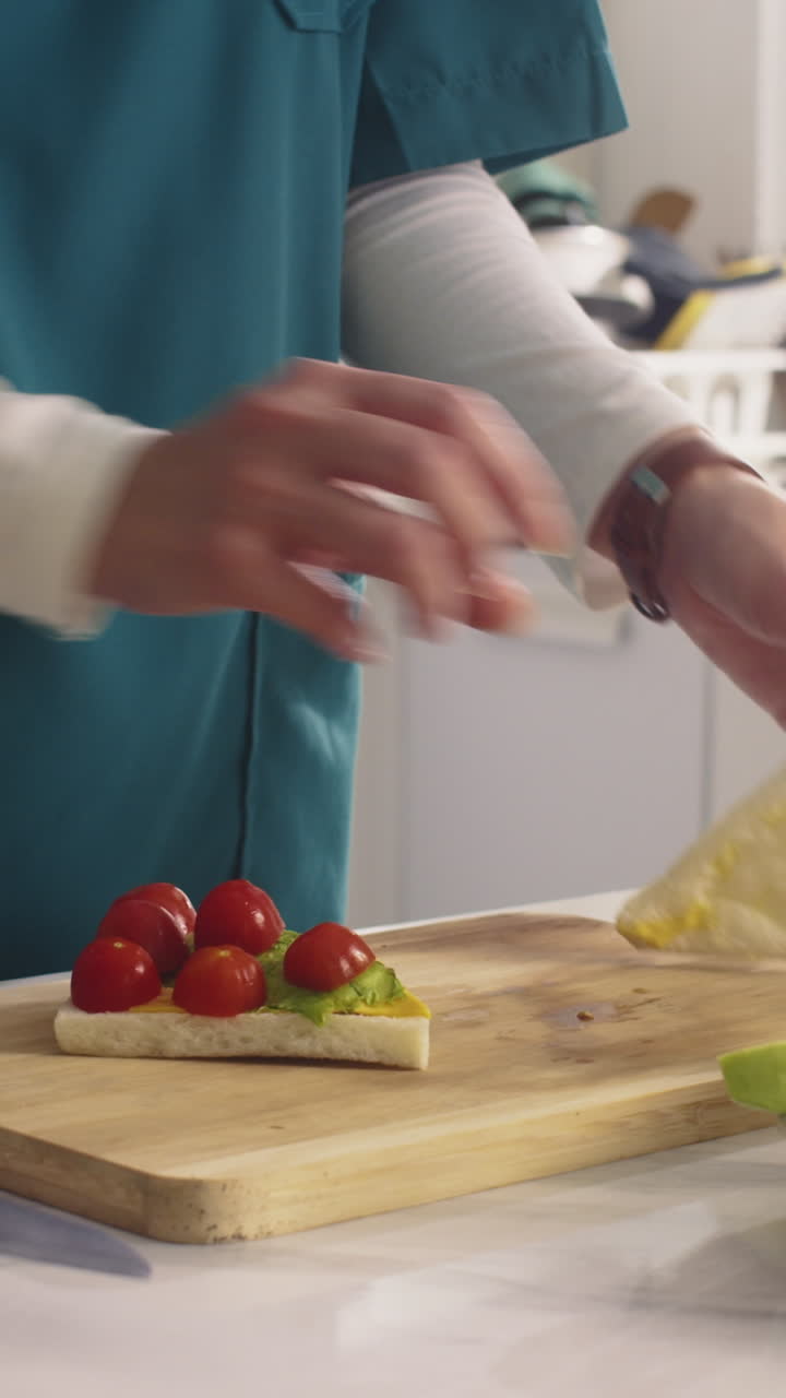 Unrecognizable Medical Worker Making Sandwich before Work